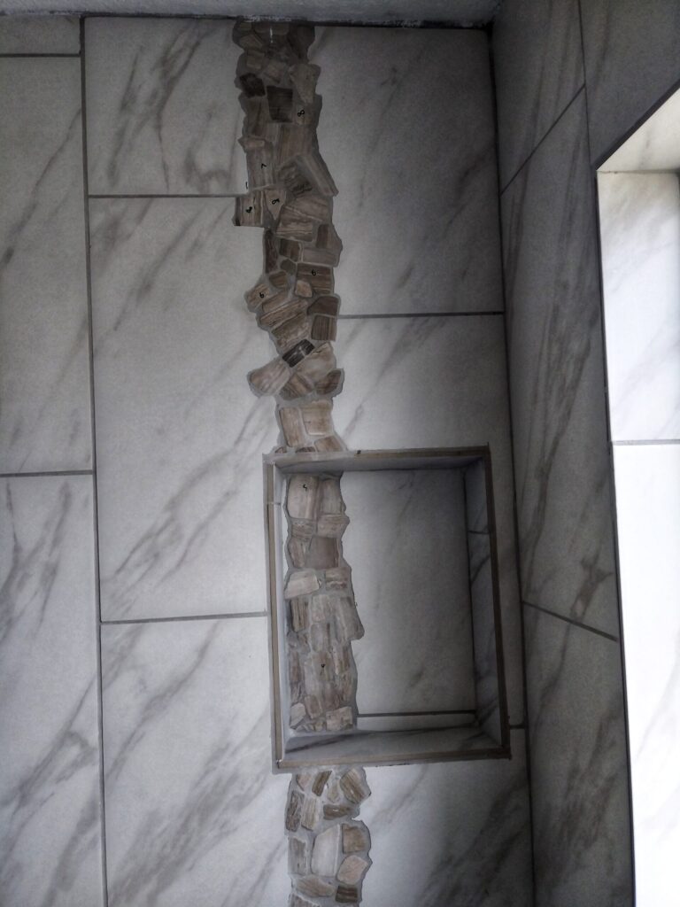 Luxury marble shower with petrified wood accent