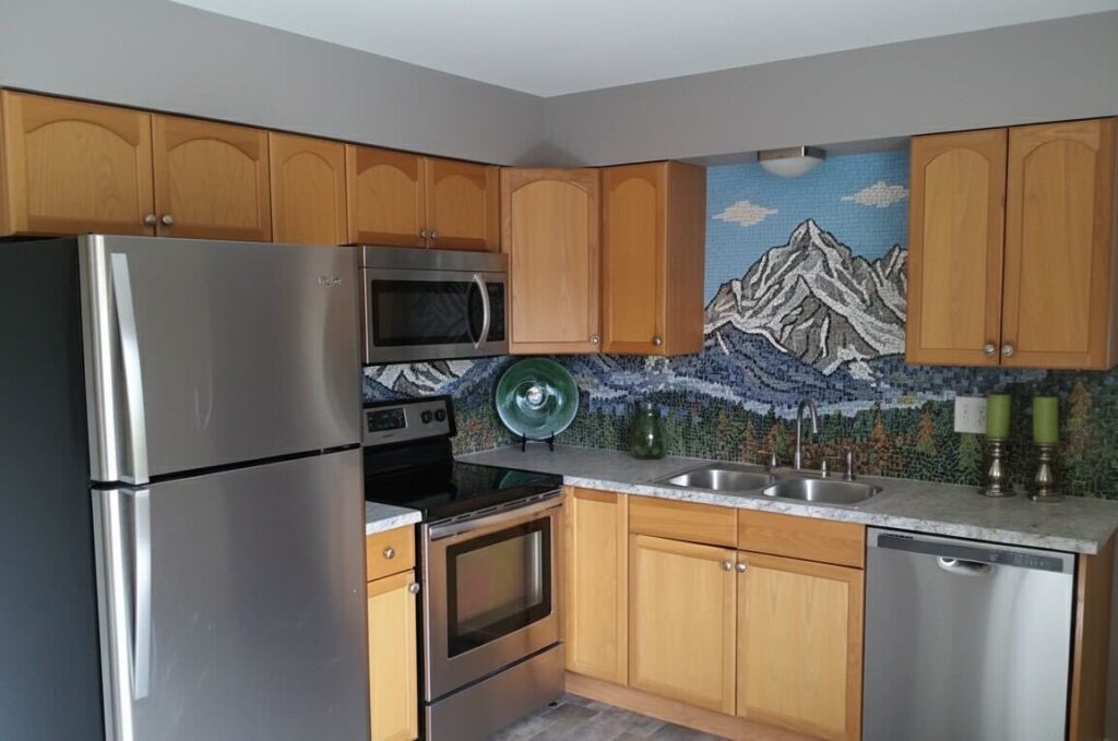 Mountain mosaic backsplash in kitchen